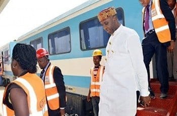 Amechi alighting from a train