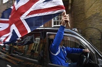 Taki Driver holding UN Flag