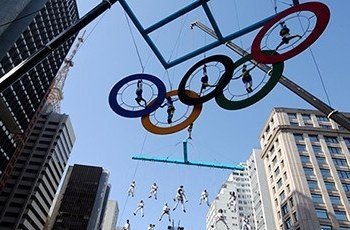 Acrobats performing on the Olympics rings