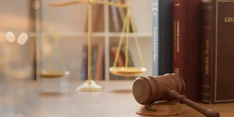 Court Gavel - Court Judgement on Social Media - A gavel resting on Nigerian law books representing Nigerian legal rights and CAMA 2020 compliance - Nigerian Consumers