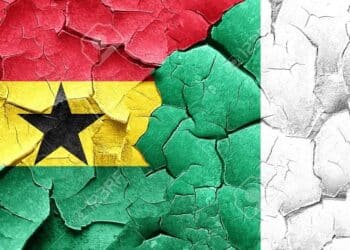Ghana flag with Nigeria flag on a grunge cracked wall