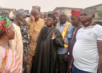 Senator Kola Balogun inspecting road construction