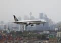 A Singapore Airlines plane arriving from Singapore lands at the international terminal at Sydney Airport, as countries react to the new coronavirus Omicron variant amid the coronavirus disease (COVID-19) pandemic, in Sydney, Australia.
