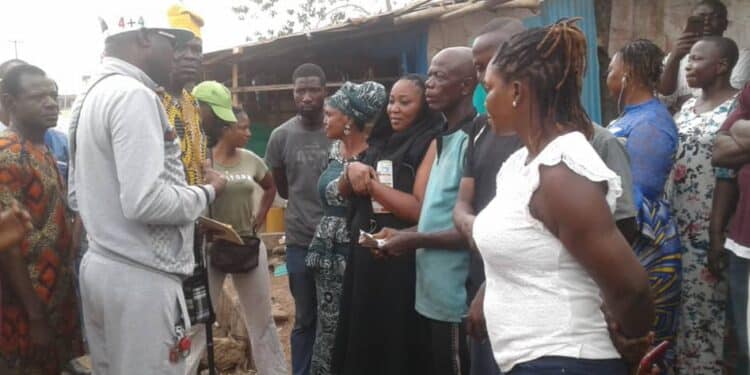 Akeem Ademola Ige with Molete traders