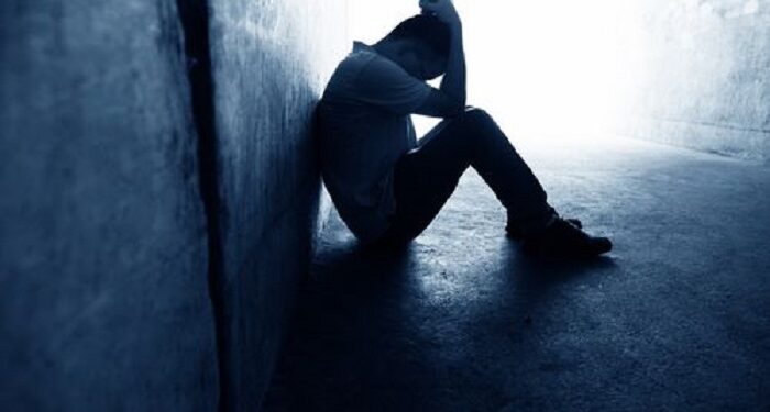 man depressed with low self-esteem