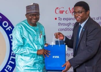 UI Vice-Chancellor, Prof Kayode Adebowale, mni, Fas with the Group Leader, Development Programmes of FIFA, Mr. Solomon Mudege.