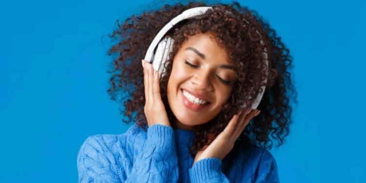 WOMAN LISTENING TO MUSIC