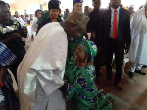 Erelu Bisi Fayemi kneeling down