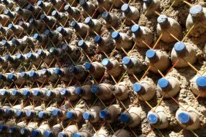 sand-filled plastic bottles used as bricks