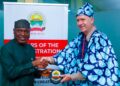 Ekiti State Governor Biodun Oyebanji, presents a souvenir to Marcel Leijzer, Manager of Technical Cooperation at the United Nations Tourism (UN Tourism).