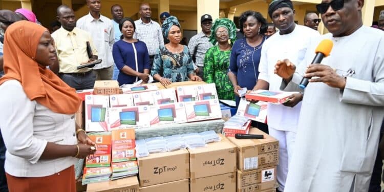 Makinde Distributes Tablets Teaching Materials