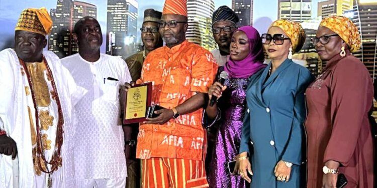 Afia Homes and Properties Chairman Mogaji Adanla receiving the Indigenous Real Estate Developer award.