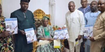 Dr Muyiwa Bamgbose presenting the Bodija Connect magazine to Olubadan Oba Rashidi Ladoja in Ibadan.