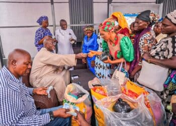Hon. Adedeji Olajide distributing food items and cash gifts to widows in Ibadan during Ramadan
