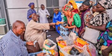Hon. Adedeji Olajide distributing food items and cash gifts to widows in Ibadan during Ramadan