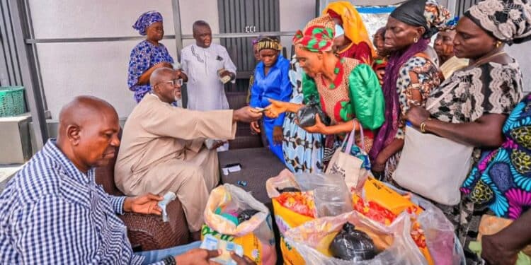 Hon. Adedeji Olajide distributing food items and cash gifts to widows in Ibadan during Ramadan