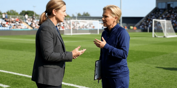 Jill Ellis and Sarina Wiegman discussing new FIFA coaching regulations on Female Coaches For All Women’s Teams