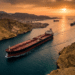 Aerial view of an oil tanker transiting the Strait of Hormuz reopening, illustrating the critical global energy shipping route during a dramatic sunset. - Iran Port Blockade - Strait of Hormuz Blockade - Global Oil Prices - Iranian Crude Oil Imports