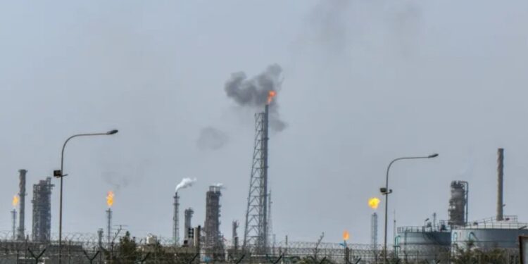 Smoke rising from Mina al-Ahmadi oil refinery units following a drone strike in Kuwait