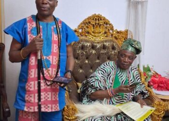 Wale Ojo-Lanre presenting Ekiti tourism landmarks to Olubadan Oba Rasidi Ladoja in Ibadan