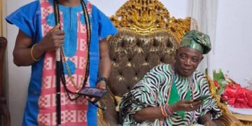 Wale Ojo-Lanre presenting Ekiti tourism landmarks to Olubadan Oba Rasidi Ladoja in Ibadan
