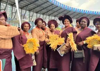 ​Members of the Ibadan Royal Women’s Club in burgundy and gold at the Ibadan Cultural Festival.