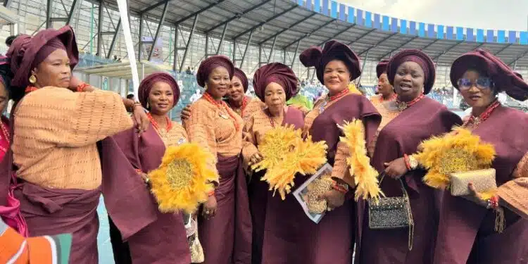 ​Members of the Ibadan Royal Women’s Club in burgundy and gold at the Ibadan Cultural Festival.