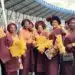​Members of the Ibadan Royal Women’s Club in burgundy and gold at the Ibadan Cultural Festival.