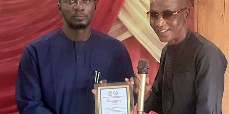 Oyo NUJ Chairman Akeem Abas speaking at the ASCOM oratorical contest podium to Mass Communication students.