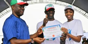 Governor Seyi Makinde speaking at the Allied Peoples Movement Oyo primary elections ahead of the Oyo State 2027 elections, with Bimbo Adekanmbi receiving his governorship certificate of return from APM party executives in Ibadan.