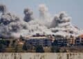 Smoke rising from building structures following intense Israeli strikes in Lebanon.