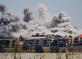 Smoke rising from building structures following intense Israeli strikes in Lebanon.