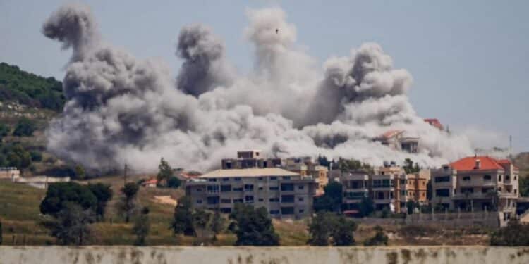Smoke rising from building structures following intense Israeli strikes in Lebanon.