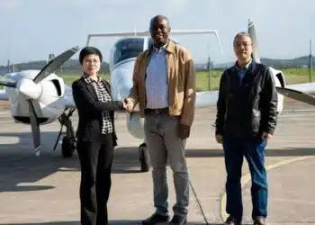 Nigerian officials inspecting aerial Oyo State Security Surveillance Aircraft acquired for Seyi Makinde's security initiative.
