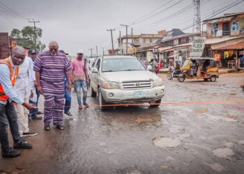 Hon Adedeji Olajide Odidiomo inspecting drainage structures during the road rehabilitation initiative.