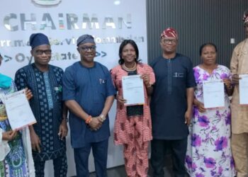 Officials distribute Oyo local government promotion letters to civil servants in Ibadan.