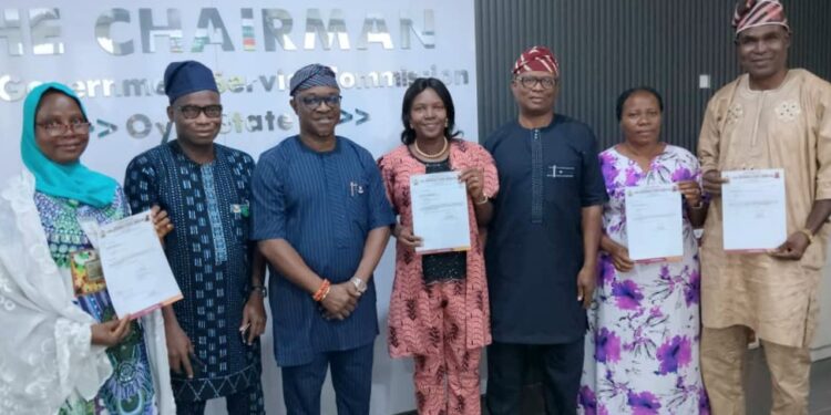 Officials distribute Oyo local government promotion letters to civil servants in Ibadan.