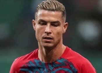 Cristiano Ronaldo in his Portugal national team jacket looking dramatically upward after leaving the training camp.