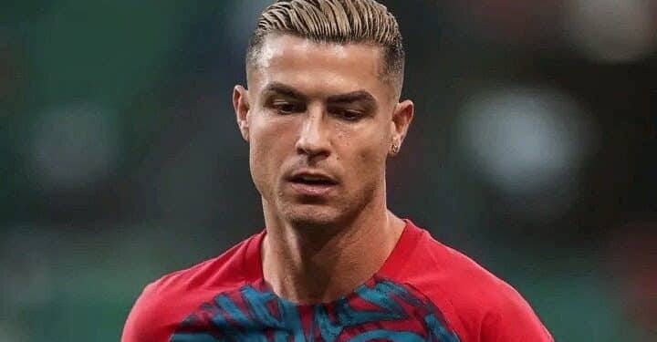 Cristiano Ronaldo in his Portugal national team jacket looking dramatically upward after leaving the training camp.