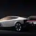 Futuristic silver Tesla Roadster concept hovering above a platform with rocket-like thrusters and dramatic red lighting.