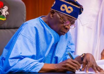 Bola Tinubu signing transport allowance for worker