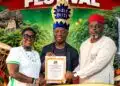 Wale Ojo-Lanre presenting official certification for the Gbagede Ule Ewa Festival to Emure-Ekiti delegation.