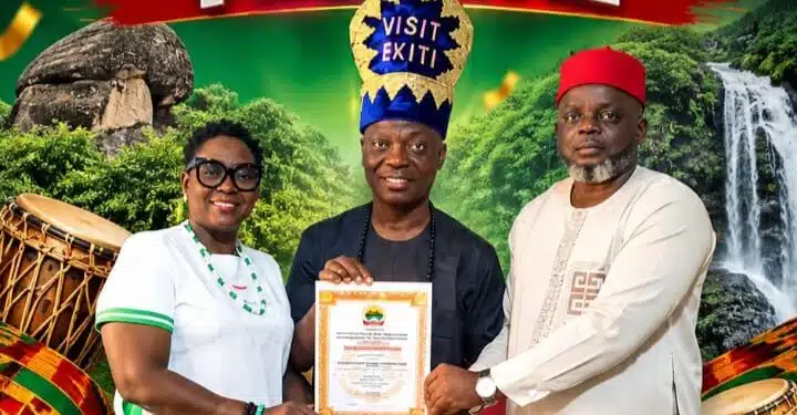 Wale Ojo-Lanre presenting official certification for the Gbagede Ule Ewa Festival to Emure-Ekiti delegation.